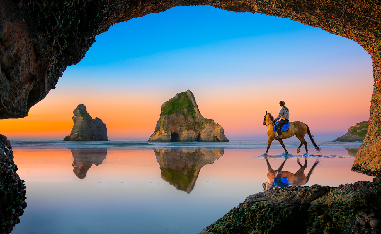 A beach with water and caves